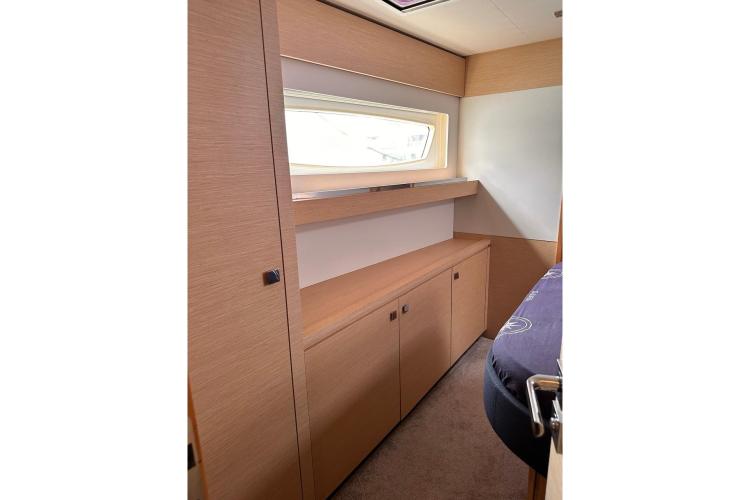 Interior of 2016 Fountaine Pajot Ipanema 58 yacht, featuring sleek wooden cabinetry.