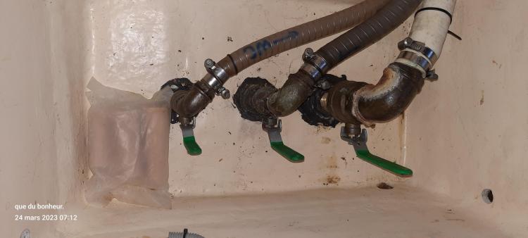 Plumbing system of a 2007 Elan Impression 434 yacht with visible pipes and valves.