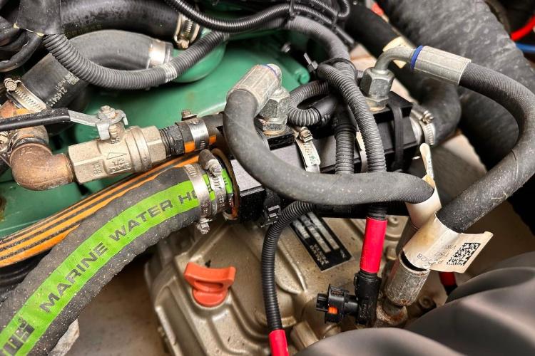 Engine components of a 2016 Fountaine Pajot Ipanema 58 catamaran, featuring marine water hoses.