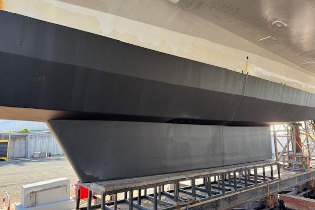 Etoile Marine Maxi Cat 24 catamaran hull, 2004 model, on dry dock for maintenance.