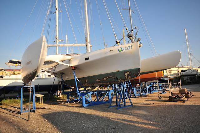 2005 Custom Polynésie 42 catamaran on stands, undergoing maintenance in a boatyard.