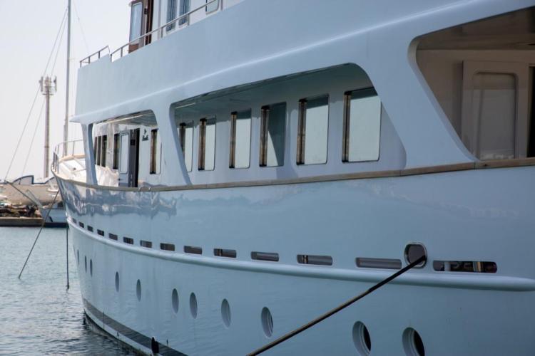 1972 Benetti 33 yacht docked, showcasing sleek design and multiple windows.