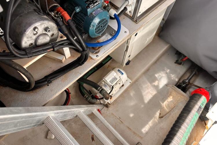 Engine compartment of 2016 Fountaine Pajot Ipanema 58 catamaran, showcasing mechanical components and wiring.