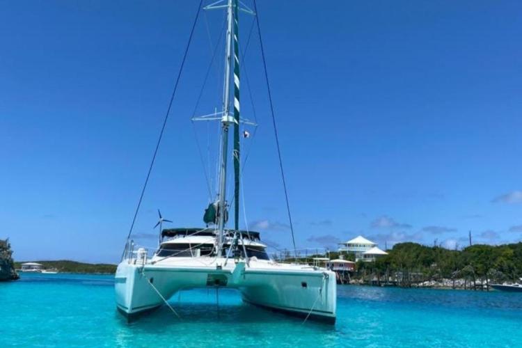 Fountaine Pajot Bahia 46 catamaran, 1999 model, anchored in clear turquoise waters.