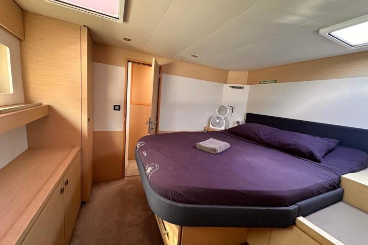 Luxurious cabin interior of 2016 Fountaine Pajot Ipanema 58 yacht with cozy bed.