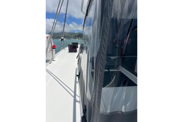 2023 Fountaine Pajot Astrea 42 Catamaran deck view with clear skies and ocean backdrop.