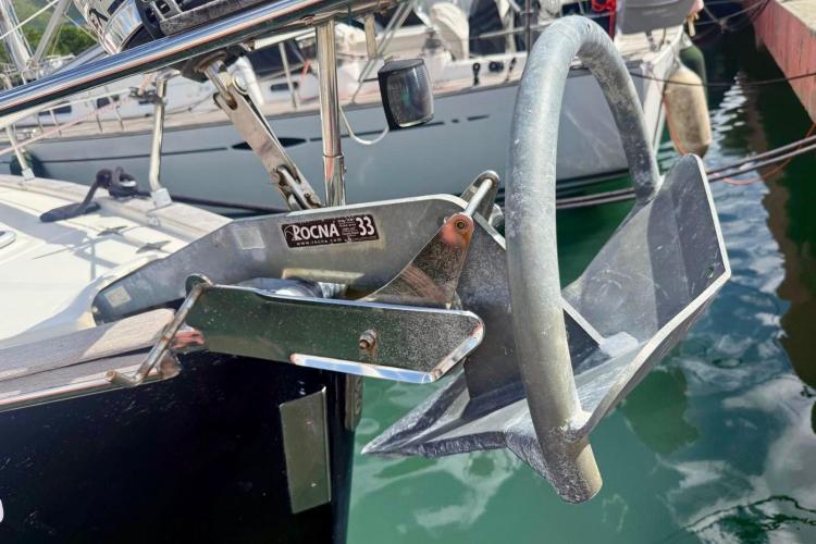 Rocna 33 anchor on a 2006 Bavaria Cruiser 46 yacht, docked in a marina.