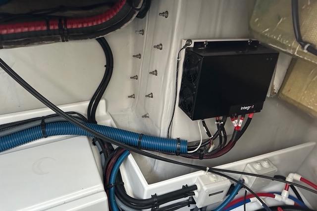 Electrical system inside 2023 Fountaine Pajot Elba yacht, featuring cables and a control box.