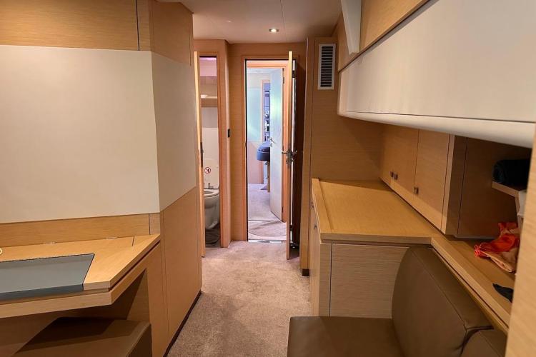 Interior of 2016 Fountaine Pajot Ipanema 58 yacht, featuring modern wood cabinetry and seating.