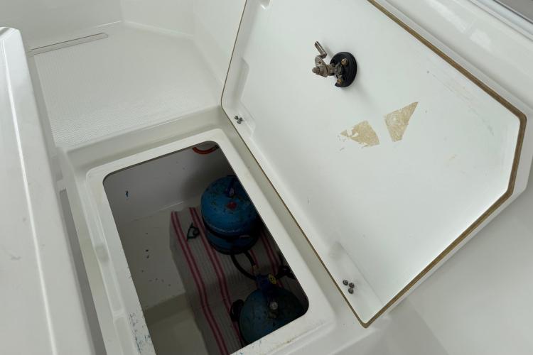 Storage compartment on a 2020 Fountaine Pajot Astrea 42 catamaran, containing gas cylinders.