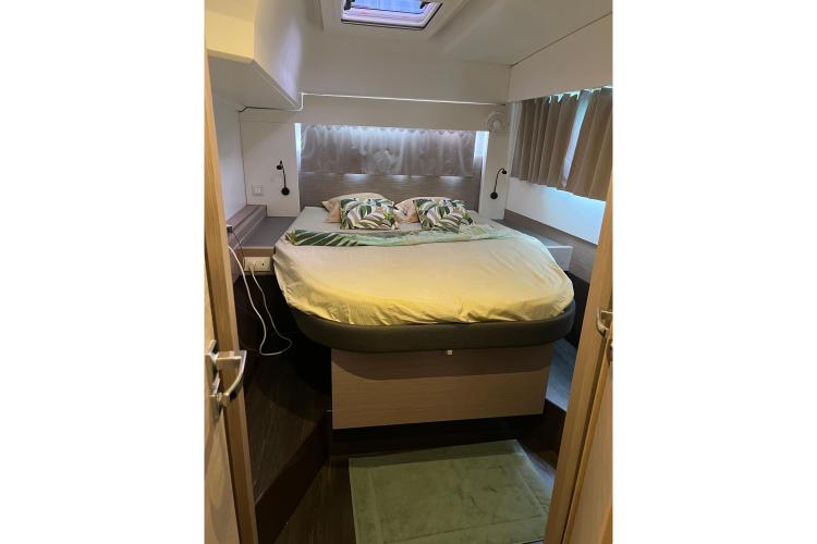 Luxurious bedroom interior of 2023 Fountaine Pajot Astrea 42 Catamaran with modern decor.