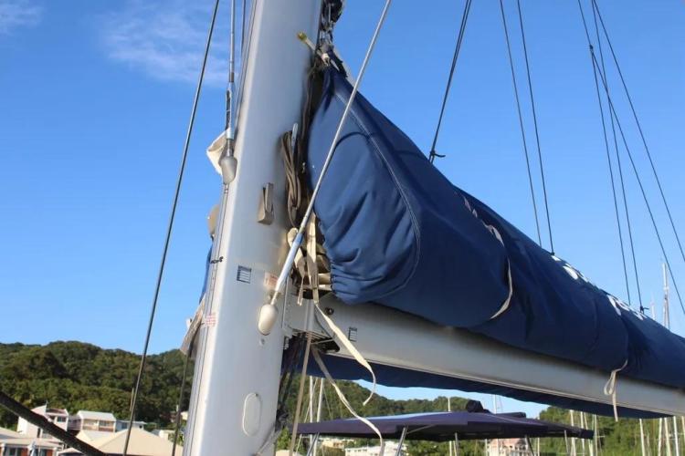 2017 Fountaine Pajot SABA 50 sailboat mast and boom with blue sail cover.