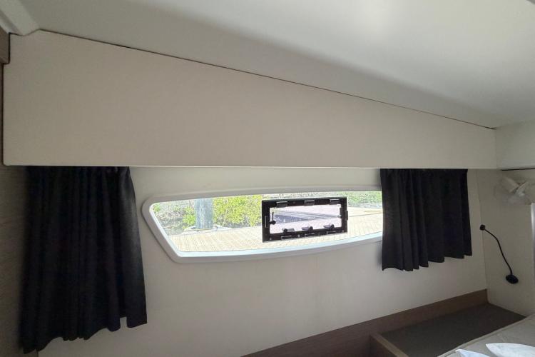 Interior cabin window of 2020 Fountaine Pajot Astrea 42 catamaran with curtains.