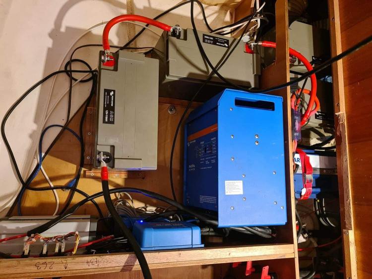 Electrical setup in a 2007 Elan Impression 434 yacht, featuring batteries and a blue inverter.