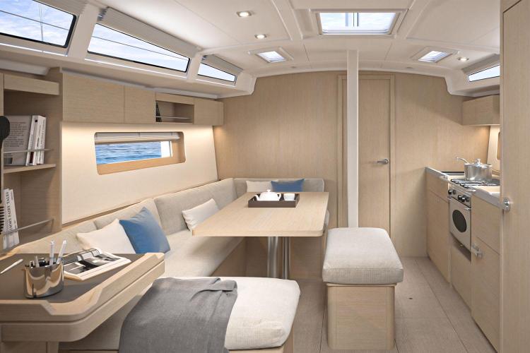 Manufacturer Provided Image: Modern interior of 2026 Beneteau Oceanis 37.1 yacht with elegant seating and kitchen area.