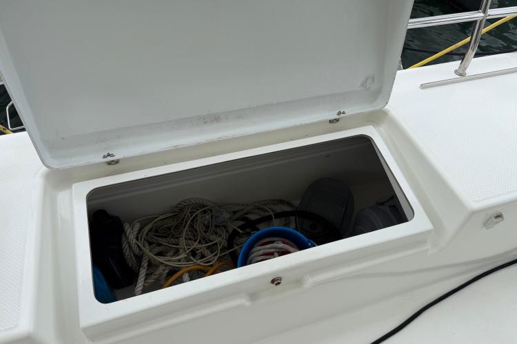 Open storage compartment on 2020 Fountaine Pajot Astrea 42 yacht, containing ropes and equipment.