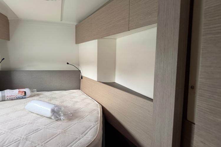 Interior cabin of 2020 Fountaine Pajot Astrea 42 catamaran with bed and storage.