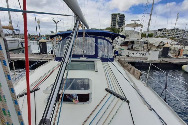 Jeanneau Sun Odyssey 37 sailboat docked at marina, showcasing deck and rigging, 2000 model.