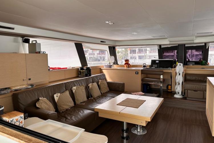 Luxurious interior of 2016 Fountaine Pajot Ipanema 58 catamaran with modern furnishings.