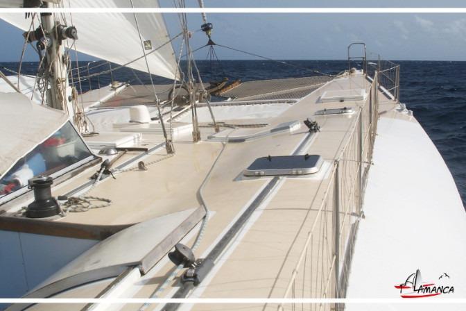 1995 Catamaran Day Charter Open Bridge Deck sailing on open sea.