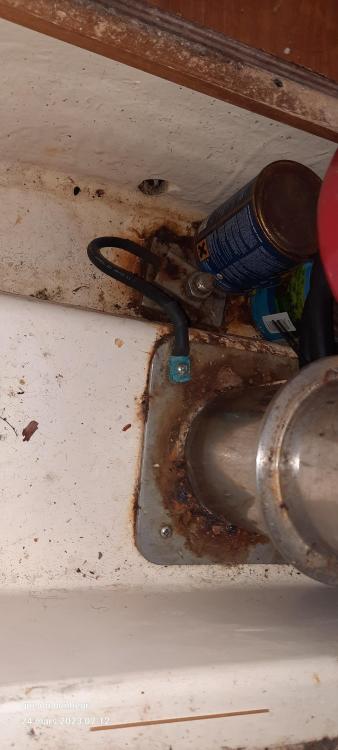 Rusty metal pipe and wiring in a 2007 Elan Impression 434 boat interior.