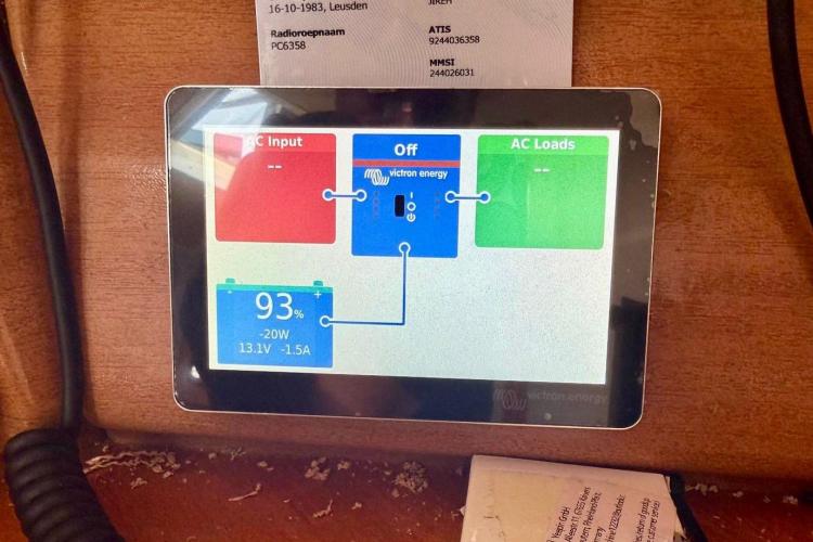 Touchscreen display on Bavaria Cruiser 46 showing battery status and power management.