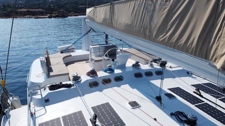 2019 Squalt Marine CK 64 yacht with solar panels, docked in serene waters.