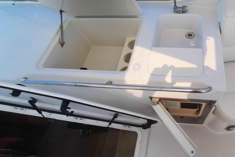 2000 Carver 530 Voyager Pilothouse yacht sink and storage area.