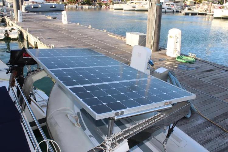 Solar panels on a 2017 Fountaine Pajot SABA 50 catamaran docked at a marina.