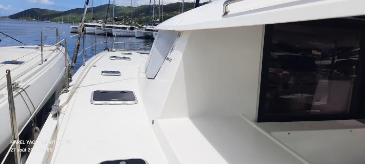 2017 Fountaine Pajot SABA 50 catamaran docked, showcasing sleek design and spacious deck.