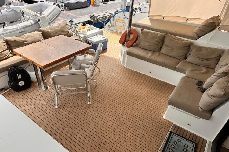 Spacious deck of 2016 Fountaine Pajot Ipanema 58 with seating and table.