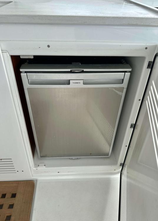 Built-in refrigerator on a 2023 Lagoon 46 yacht, with a sleek, modern design.