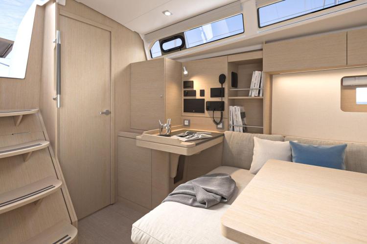 Manufacturer Provided Image: 2026 Beneteau Oceanis 37.1 interior, featuring modern design with light wood finishes and cozy seating.