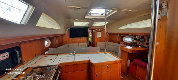 Interior of 2007 Elan Impression 434 yacht with wood finish and modern amenities.