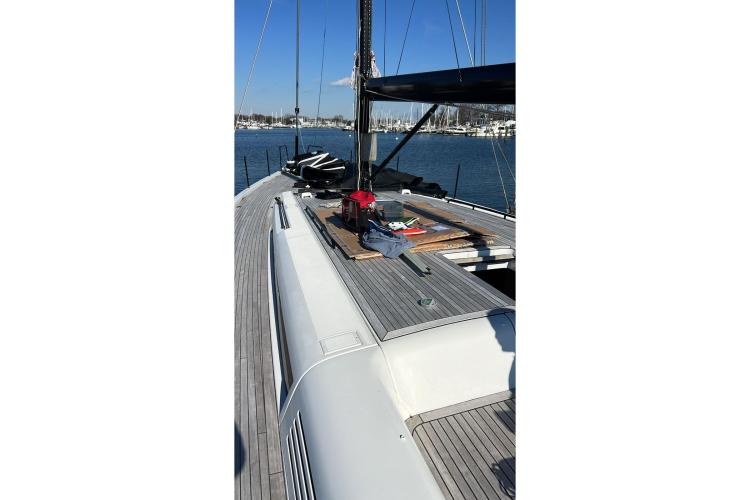 2024 Beneteau First 53 yacht deck with sleek design and marina view.