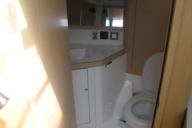 Interior bathroom of 2019 Beneteau Oceanis 46.1 yacht, featuring modern fixtures.
