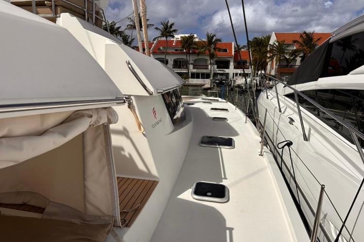 2016 Fountaine Pajot Ipanema 58 catamaran docked, showcasing sleek design and spacious deck.