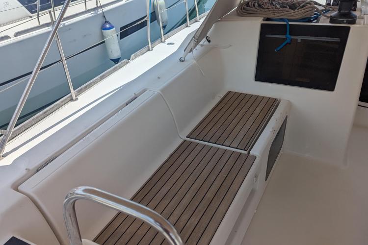 2017 Dufour 460 Grand Large yacht cockpit with wooden seating and nautical equipment.