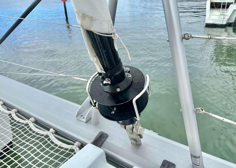 2023 Lagoon 46 sailboat rigging detail with netting and water background.