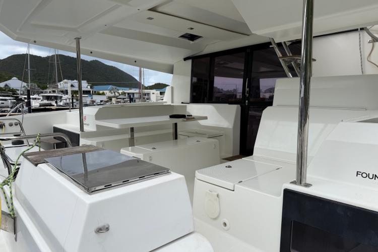 2020 Fountaine Pajot Astrea 42 yacht deck with seating and marina view.