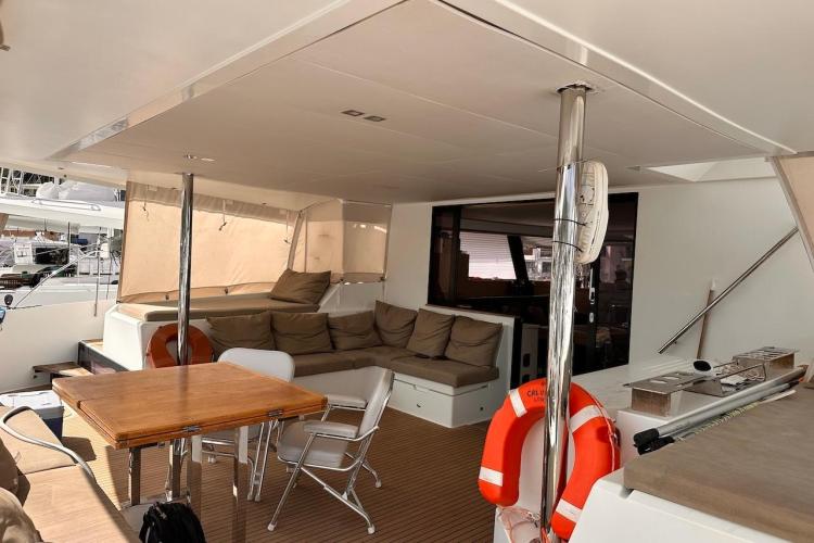Luxurious 2016 Fountaine Pajot Ipanema 58 yacht interior with seating and dining area.