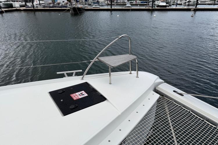 2020 Fountaine Pajot Astrea 42 catamaran deck with seating, docked at marina.